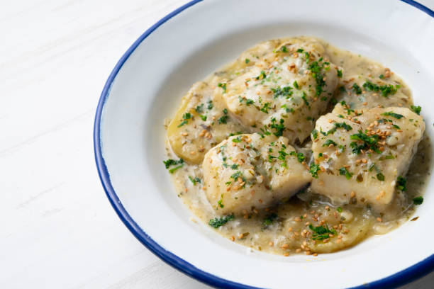 istock Cod in green sauce with potatoes. Traditional northern Spanish tapa 1361929650