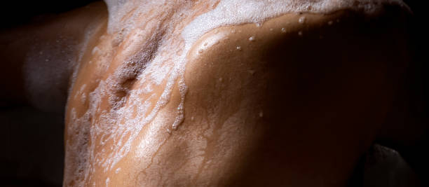 istock Back of a man relaxing in a foam bath 1361932537