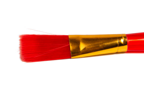 istock Red plastic brush for paint isolated on the white background 1361933069