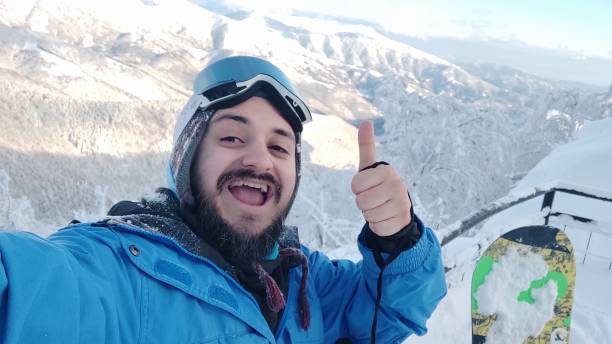 istock Snowboarder showing thumbs-up sign 1361937970