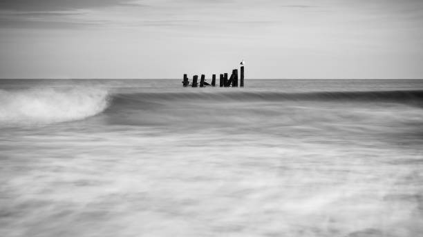 istock waves and old sea defences- mono iii 1361938448