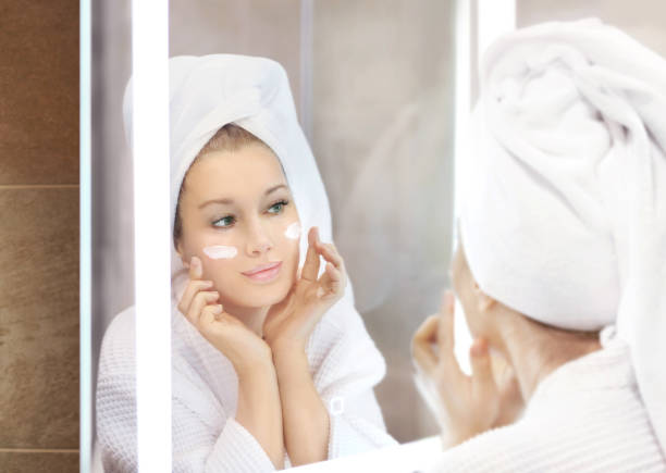 istock Magic anti-aging cream.Applying the cream. 1361941517