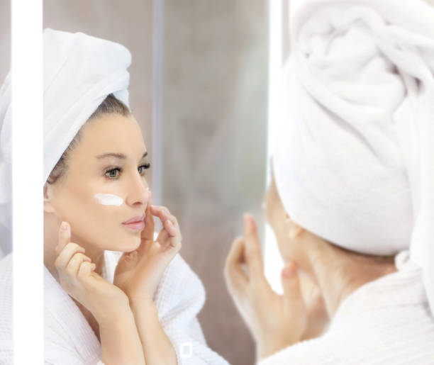 istock Magic anti-aging cream.Applying the cream. 1361941530