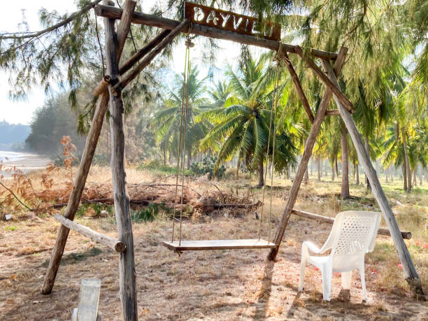 istock Wooden swing set on the beach 1361944732