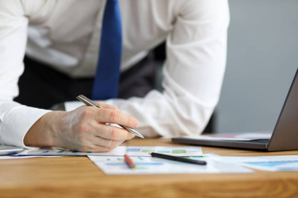 istock Man in business clothes leaned over table home 1361954989