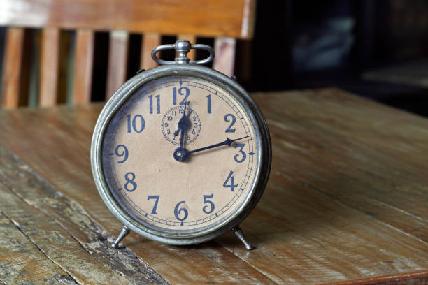 istock Old alarm clock on wood table 1361955260