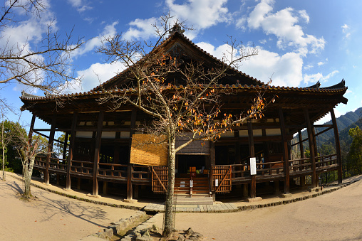 Senjokaku (Toyokuni Shrine) on a sunny autumn day on the Island of Itsukushima. It is an island in the western part of the Inland Sea of Japan, located in the northwest of Hiroshima Bay. It is popularly known as Miyajima (宮島), which in Japanese means \