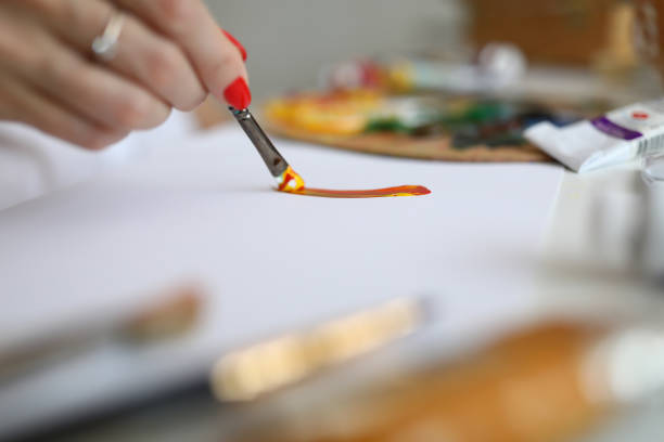 istock Close-up of female painter creating new picture 1361962914