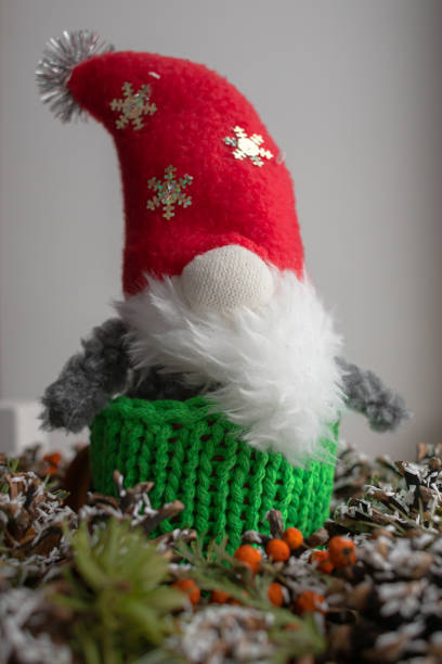 istock Hand-sewn Santa Claus in a knitted cup 1361967255