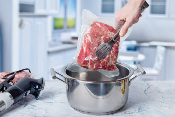 istock Concept of cooking meat in a vacuum using sous-vide technology. 1361968274