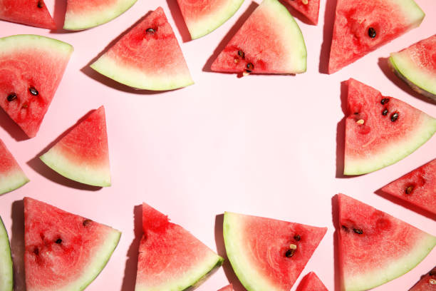 istock Frame of watermelon slices on pink background, flat lay. Space for text 1361971711