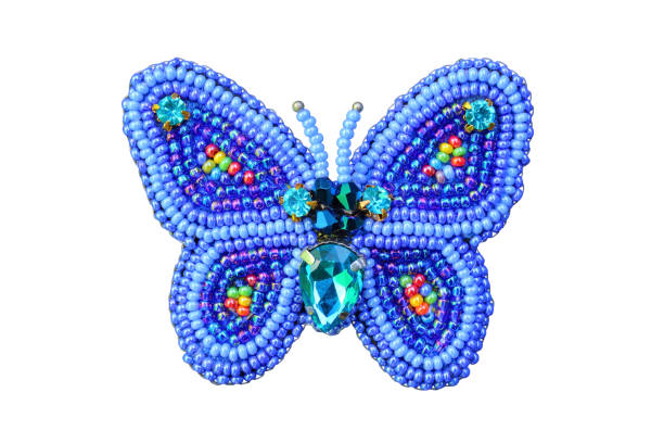 istock Brooch from beads a butterfly. Close-up. Isolated object on white background. Isolate. 1361972793