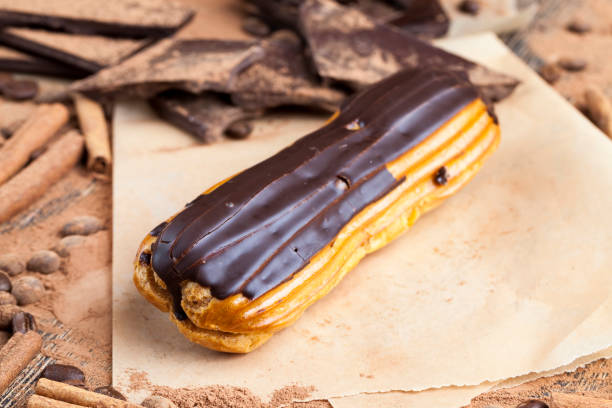 istock chocolate-covered custard eclair with creamy chocolate cream 1361980267