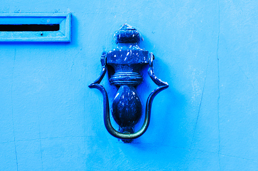 Old Blue door with door handle in Rabat, Morocco