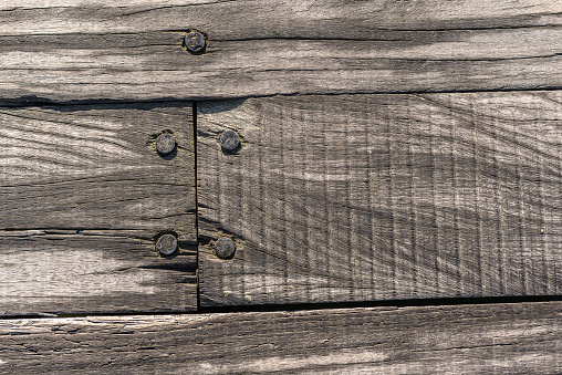 Wood background with rusty nails and vintage look.