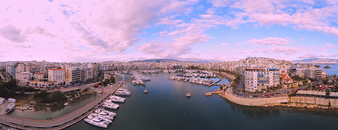 A scenics aerial view of the city of Marseille, bouches-du-rhône, France with a cruise ship arriving at the port under a majestic blue sky and some white clouds on March 24, 2023 in Marseille, bouches-du-rhône, France