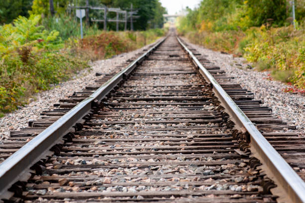istock railroad tracks in a summer day 1361989173