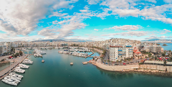 The Strait of Messina between Sicily and Italy. View from Messina town with golden statue of Madonna della Lettera and entrance to harbour. Calabria coastline in background.