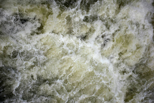 istock Bubbling water with foam and splashes all over the frame 1361992984