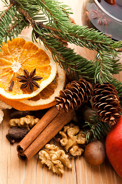 Different kinds of spices, nuts and dried oranges