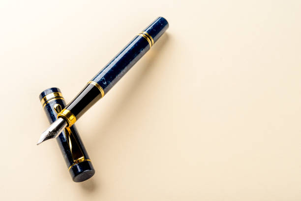 istock Fountain pen detail on colorful background photographed in studio. 1362002921