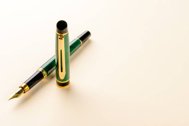 Fountain pen detail on colorful background photographed in studio. stock photo