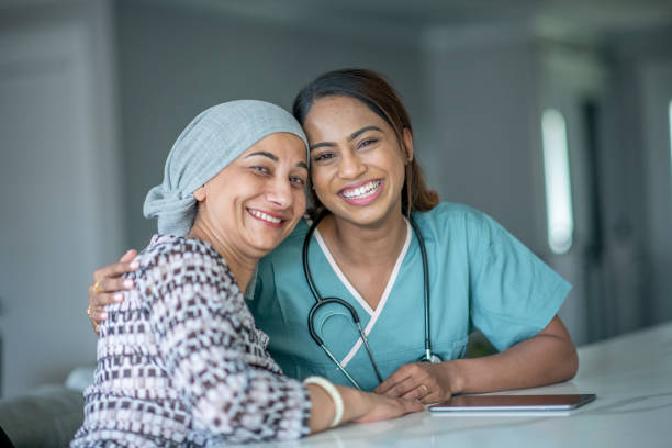 istock Cancer Patient Sharing a Hug with a Nurse 1362003622