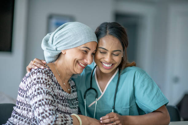 istock Cancer Patient Sharing a Hug with a Nurse 1362003623