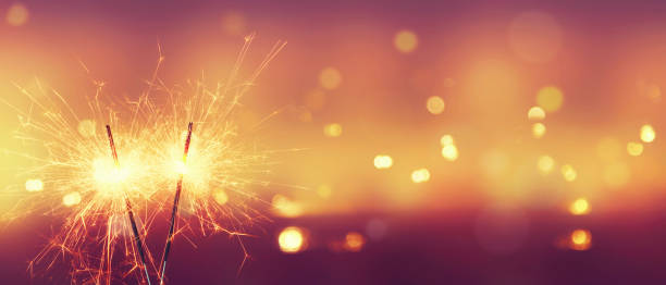 istock Happy New Year background with glowing sparklers. 1362004927