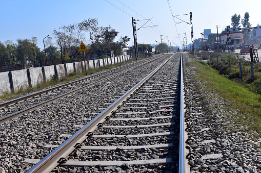 Train arriving at station and one leaving. High angle view.