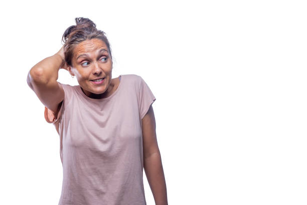 istock embarrassed woman looking to a side on a white background 1362023856