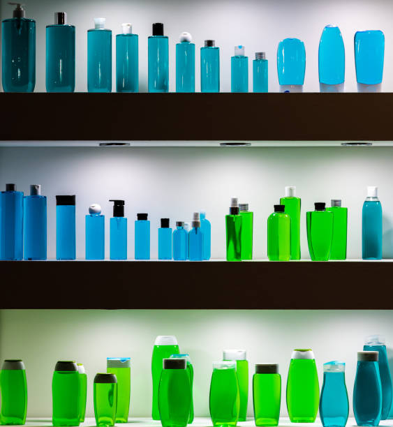 istock Many colorful plastic bottles standing on the iluminated shelf. 1362038282