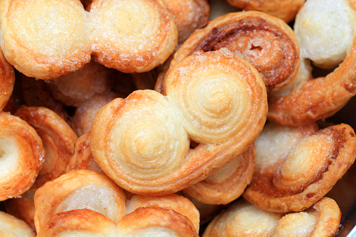 Palmiers in close range, puff pastry with sugar.