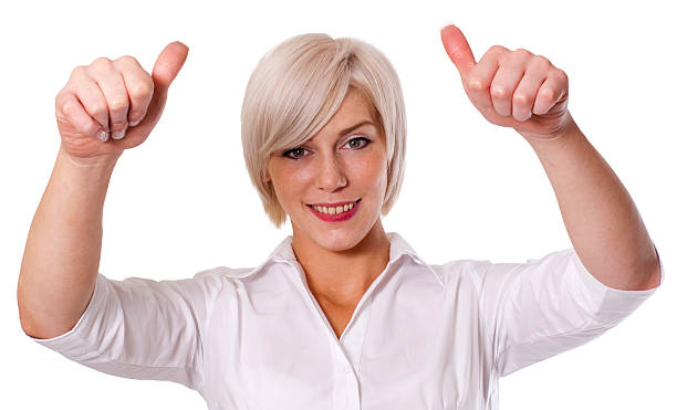 Young business woman with thumbs up stock photo