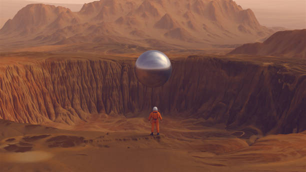 istock Orange Spaceman Spacewoman With Large Alien Silver Sphere Crater Arid Desert Mountain Sci Fi Astronaut Cosmonaut Landscape 1362044837