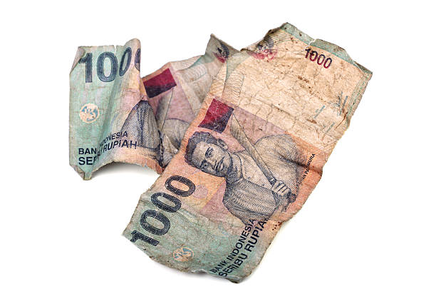 istock Crumpled Indonesian banknotes on white. 136204802