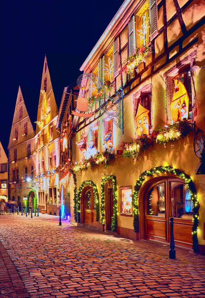cozy street of Kaysersberg old village on Christmas holidays. Alsace, France cozy street of Kaysersberg old village on Christmas holidays. Alsace, France colmar stock pictures, royalty-free photos & images