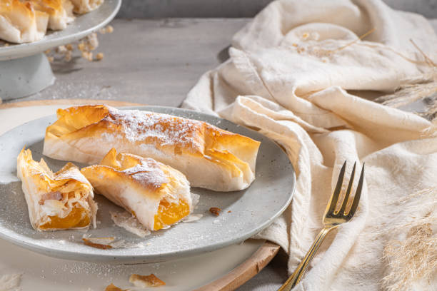 istock Typical portuguese sweets Pasteis de Vouzela served on countertop. Filo pastry with egg cream filling 1362067548