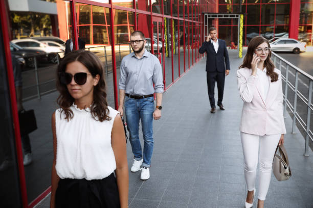 istock Different people walking on modern city street 1362068756