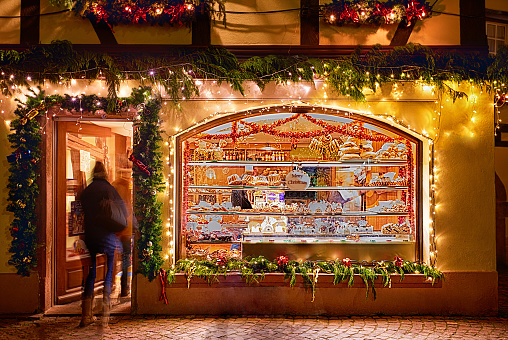 patisserie showcase at christmas evening, winter holidays