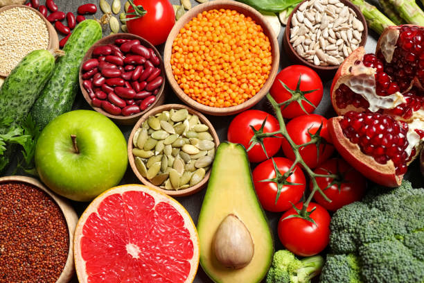 istock Fresh vegetables, fruits and seeds on grey table, flat lay 1362075041