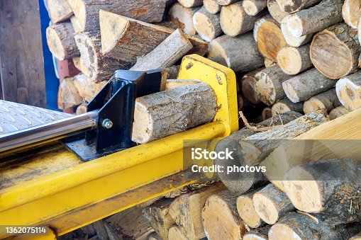 istock Hydraulic splitter machine wood splitting a log 1362075114