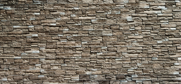 Backgrounds of brown stone wall.