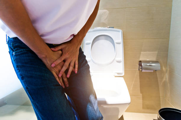 Man with bladder pain in toilet Man with bladder pain in toilet. urinary tract infection stock pictures, royalty-free photos & images