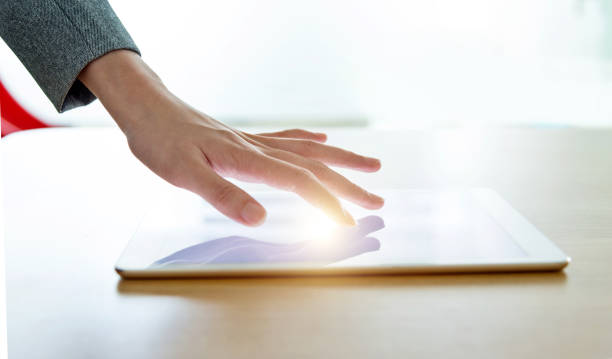 istock Businesswoman hand pointing to digital tablet 1362075742