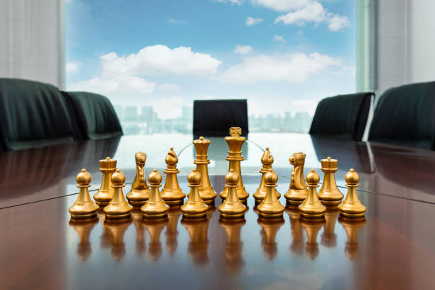 istock Golden pieces standing on office table 1362076299