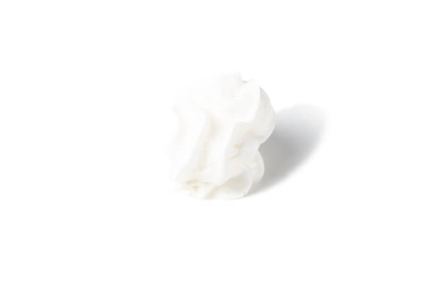istock Airy white whipped cream on a white background 1362079531