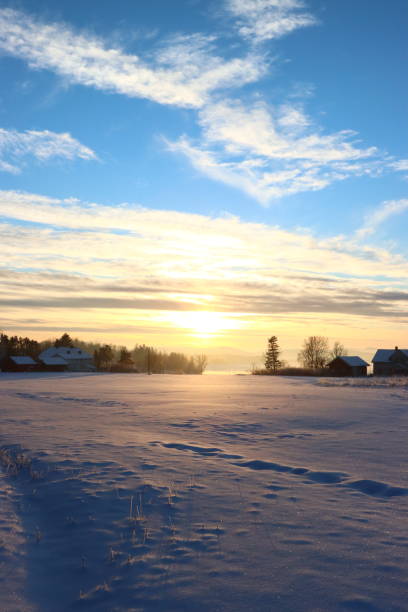 istock Winter Sunset, farmhouses foreground 1362084269