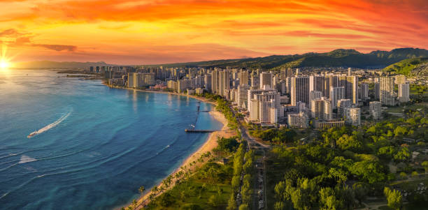 Honolulu with a vibrant red sunset Honolulu skyline during blue hour honolulu stock pictures, royalty-free photos & images
