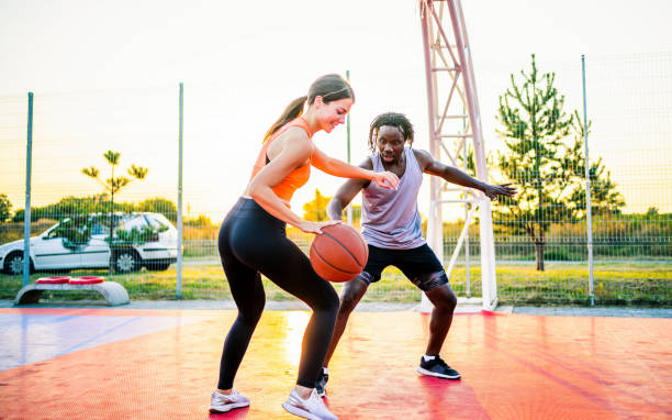istock Couple enjoying basketball match 1362089235